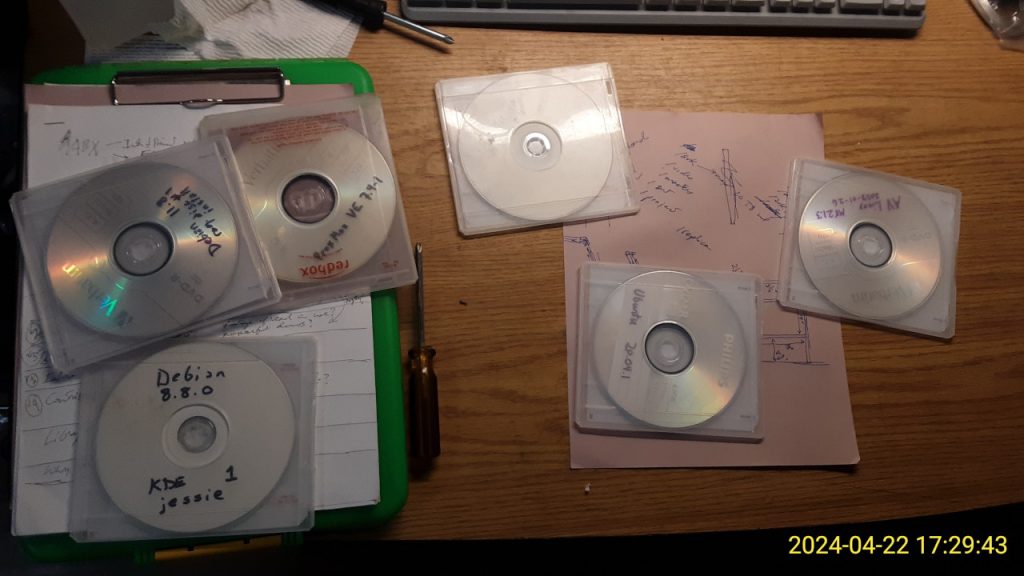 Linux installation disks on my workbench.